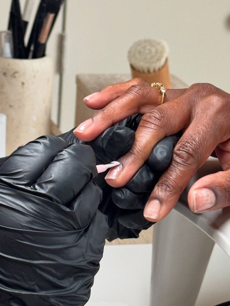 Close view of a nail service in progress